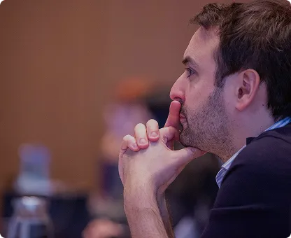 Speaker presenting expert insights on stage